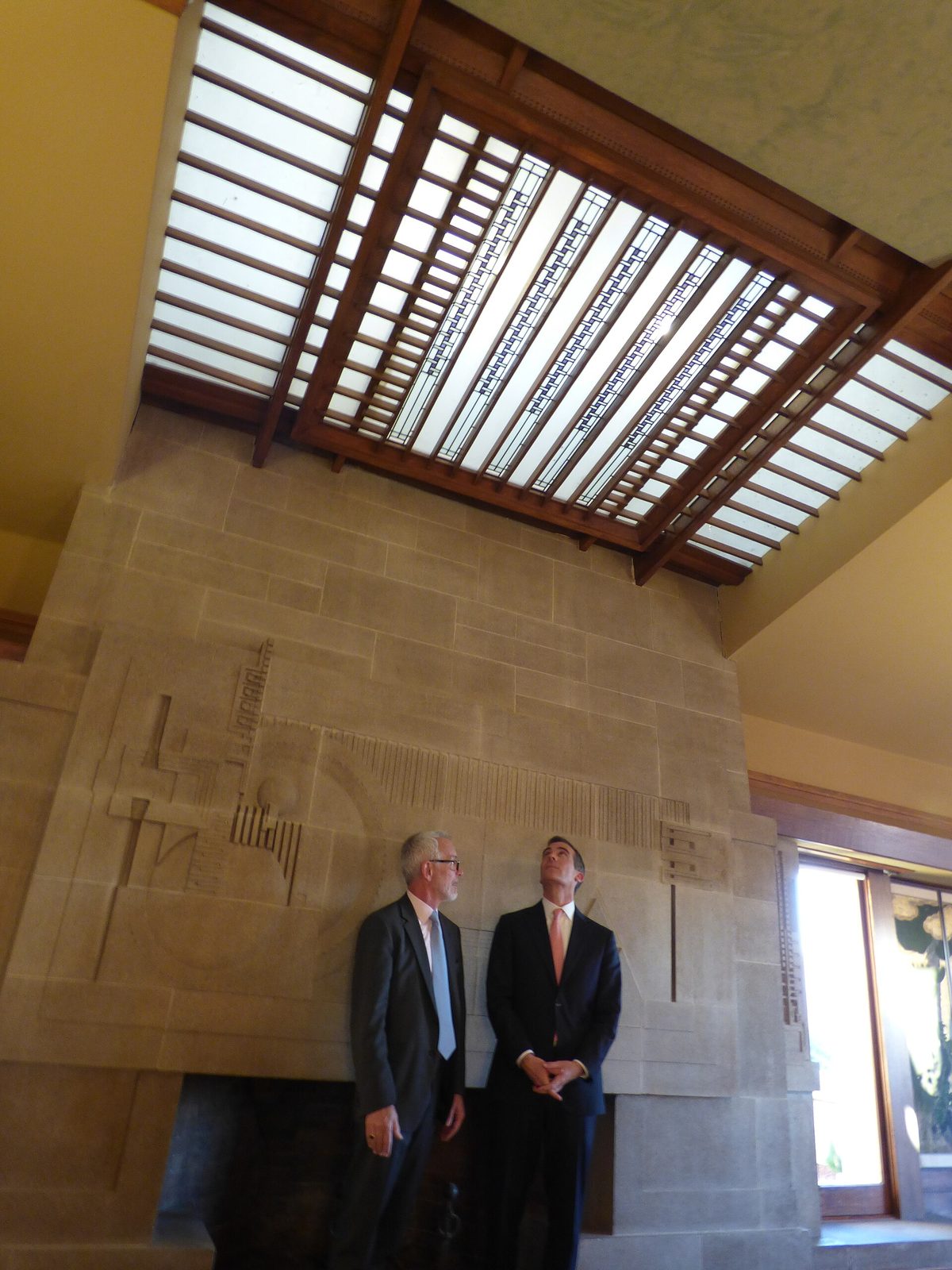 Mayor Eric Garcetti and a guest in the living room beneath the skylight on reopening day, February 2015