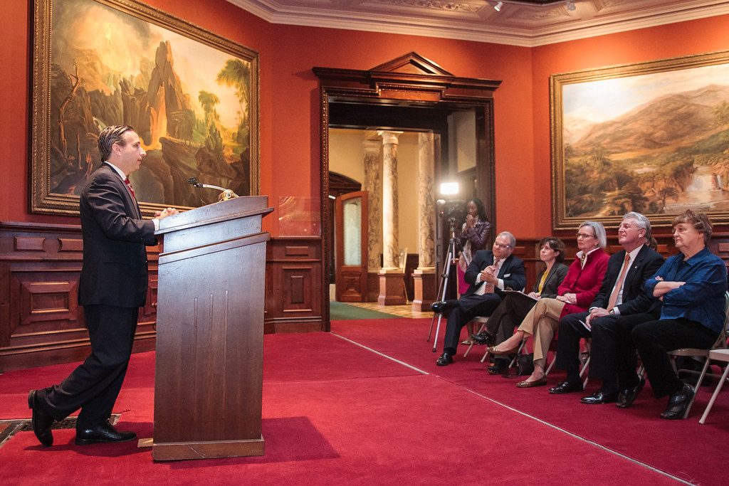 Preservation grant announcement with speakers and guests in the mansion gallery, October 2014