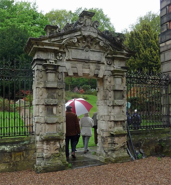 Visitors passing through the South Court gateway into the gardens, May 2013